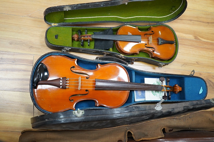 A quantity of violin parts and violins, a ukelele, a double bass scroll, a pinfold metronome, a violin case by Hill, a viola etc. Condition - for restoration